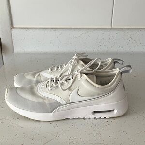 Nike Air Max Thea sneakers in white and gray.